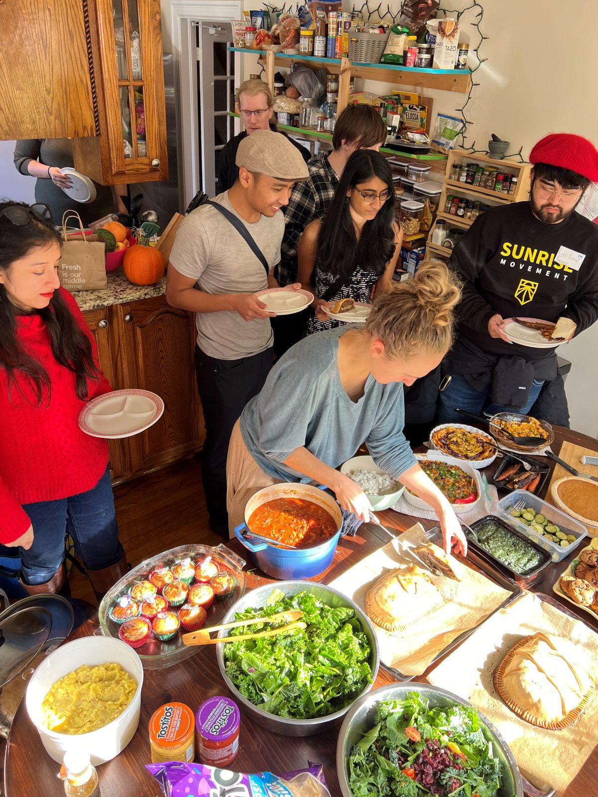 A shared family-style meal at the Movement House