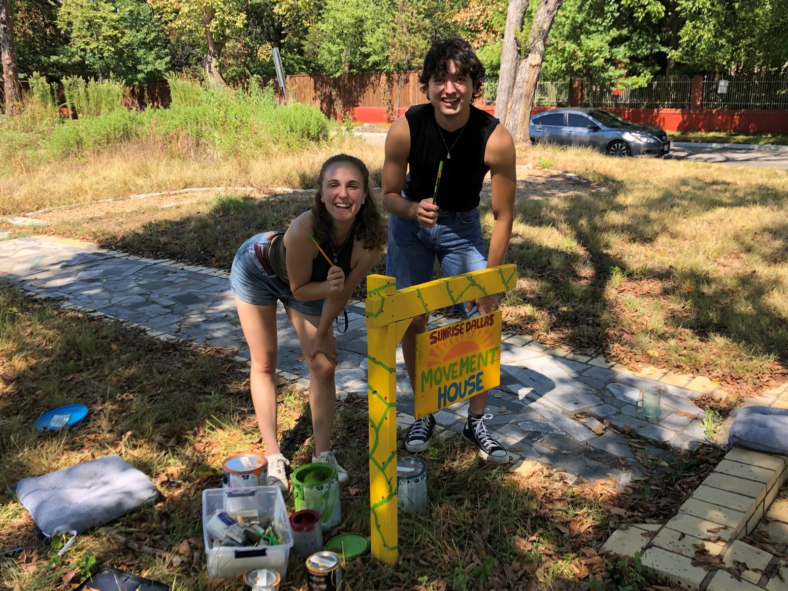 Painting the Movement House sign