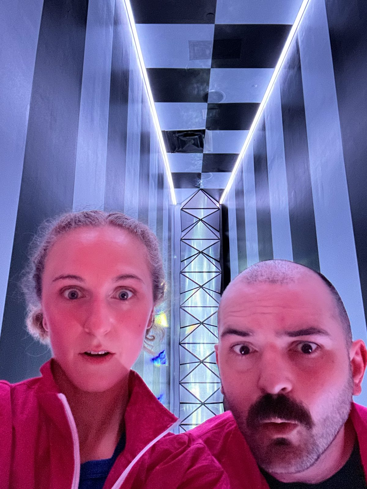 Hope in alien costume performing at Meow Wolf